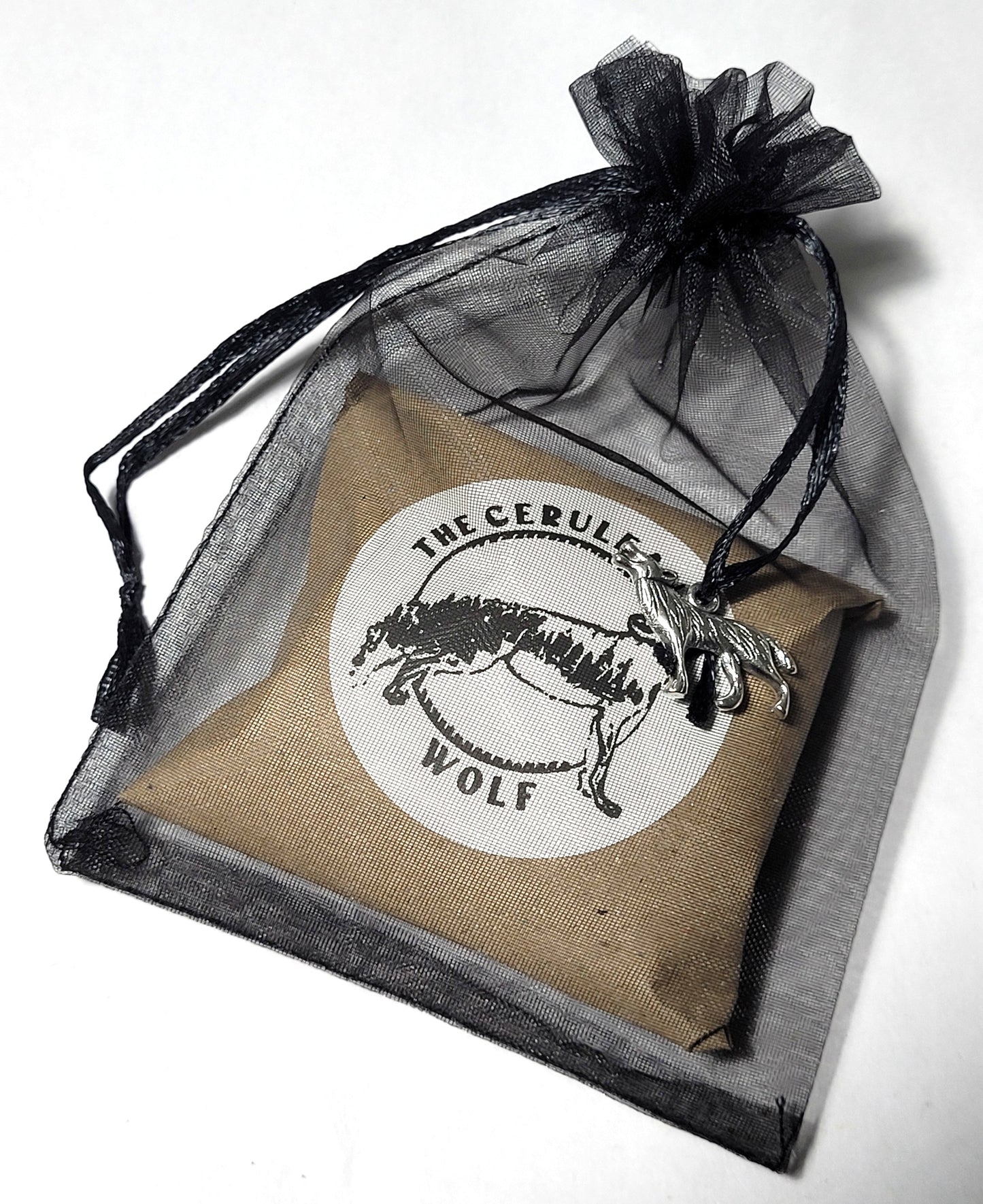 Brown, packaged order in a drawstring bag with 'The Cerulean Wolf' label on a white background